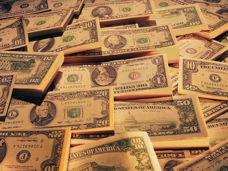 stacks of us currency bills