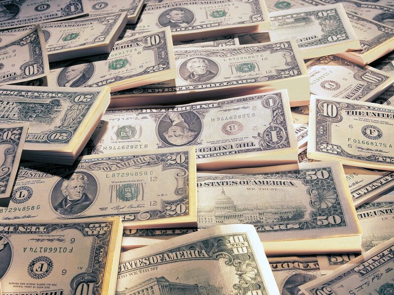 stacks of us currency bills