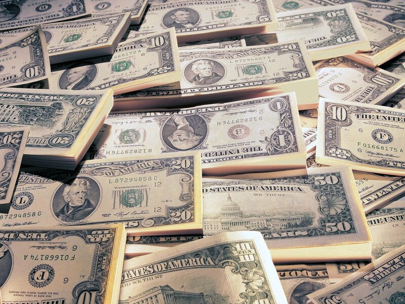 stacks of us currency bills