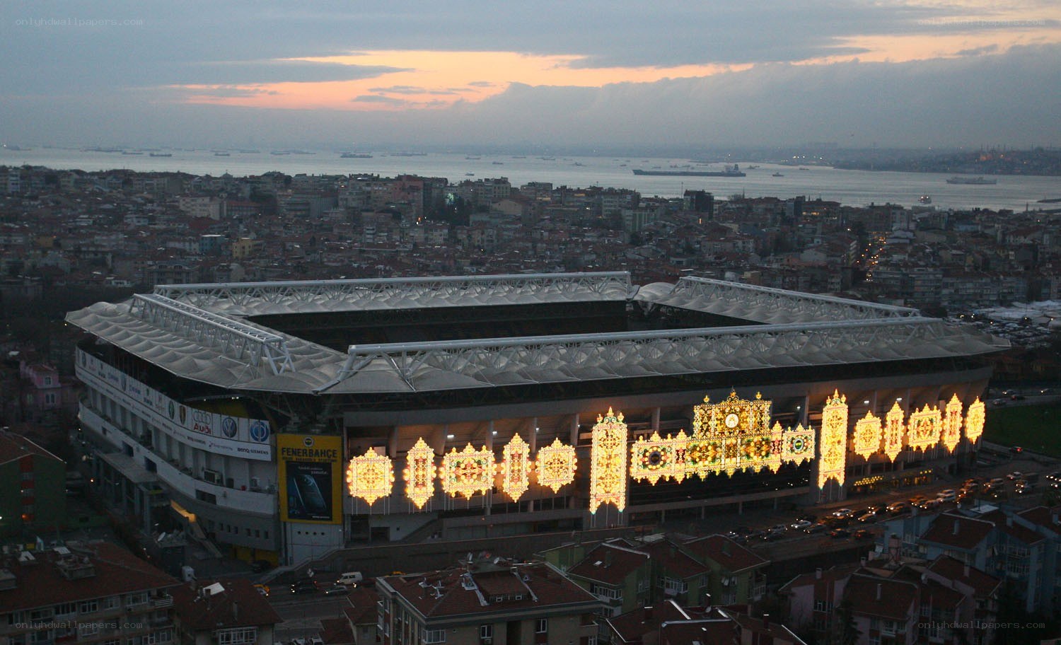 stadium at dusk with city view
