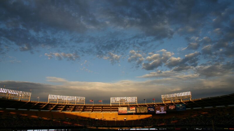 Stadium at dusk with cloudy sky