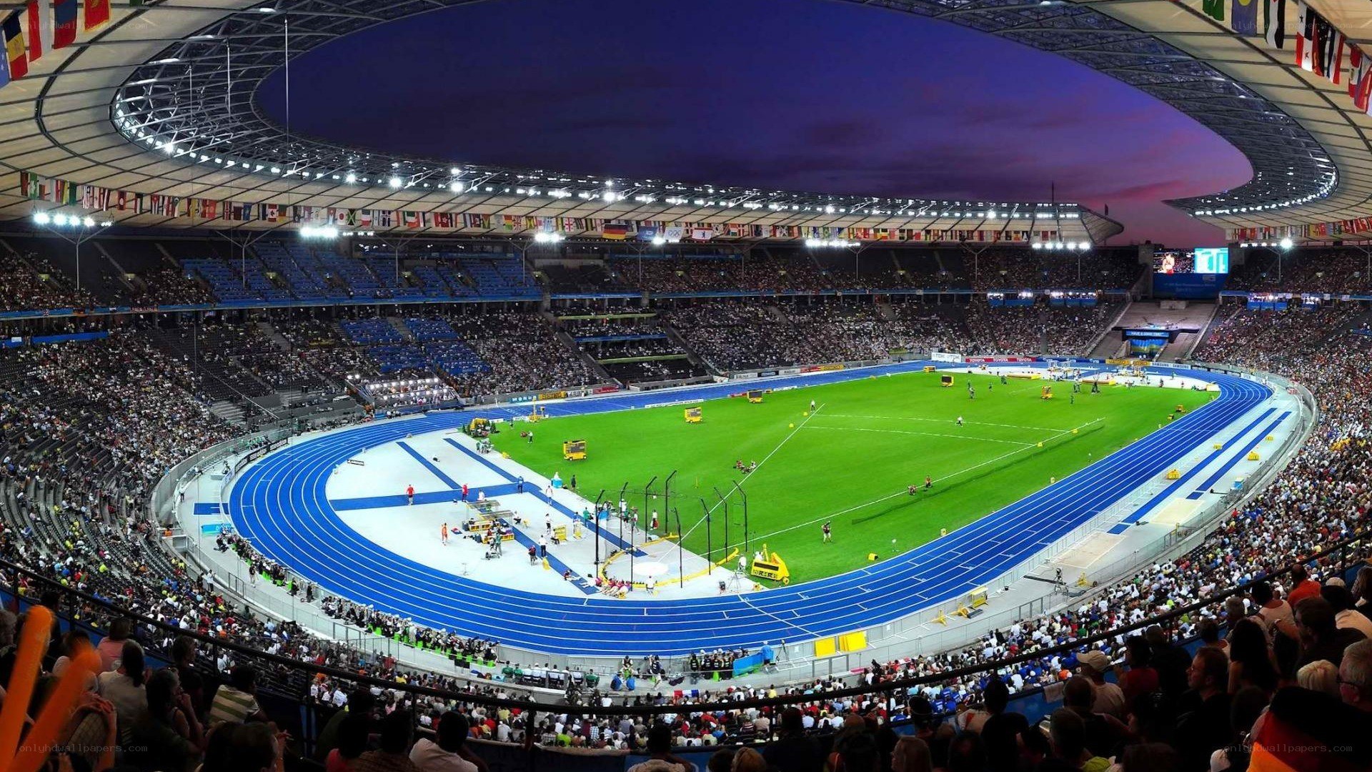 Stadium at night with track and field