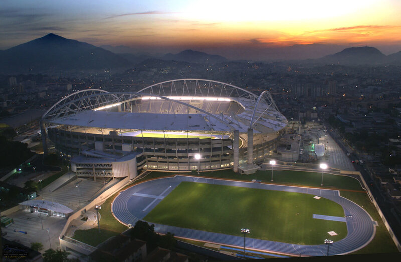 Stadium at sunset with city view