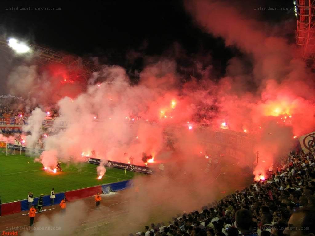 Stadium fans with flares