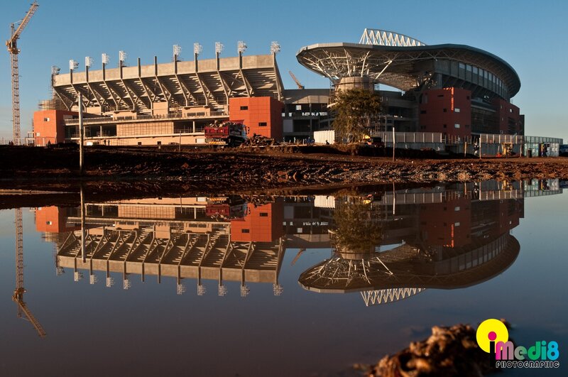 Stadium under construction with reflection