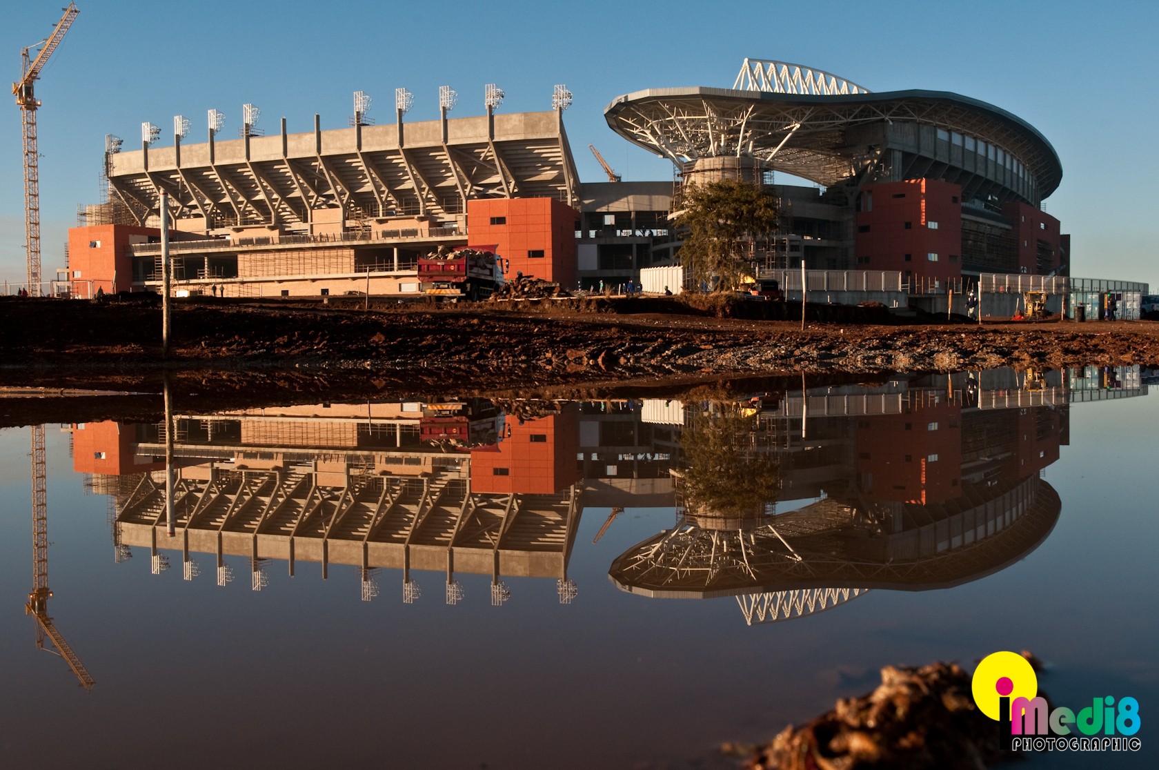 Stadium under construction with reflection