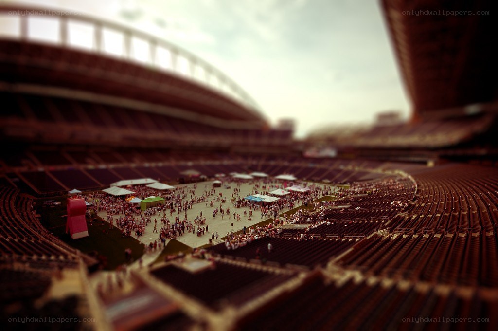 Stadium with crowd and tents