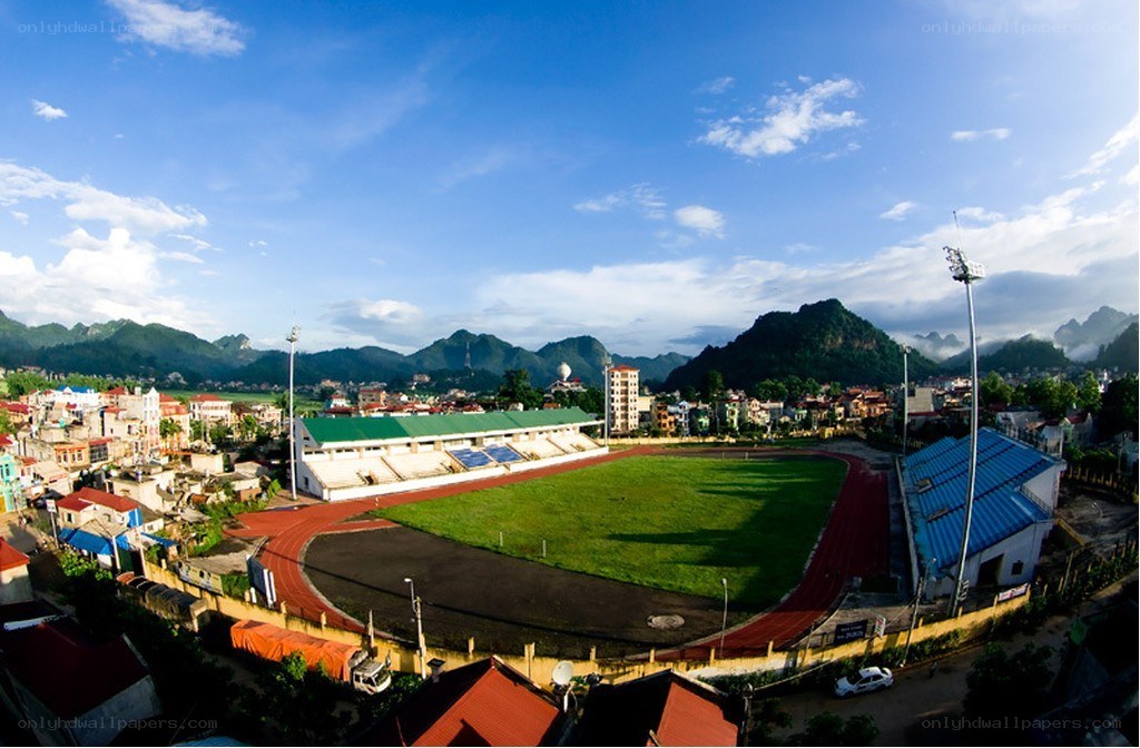 stadium with mountains in background