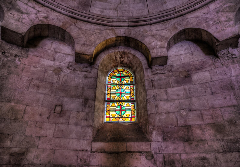 Stained Glass Window in Stone Wall