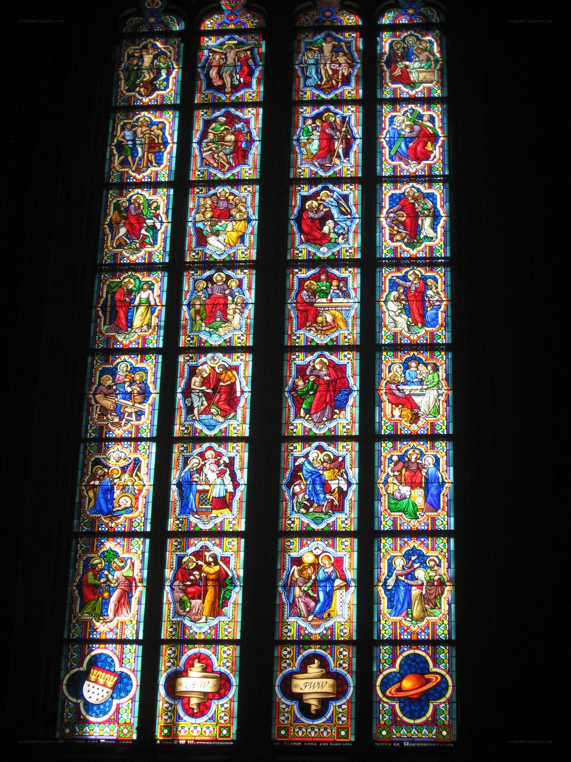 Stained glass window with religious scenes