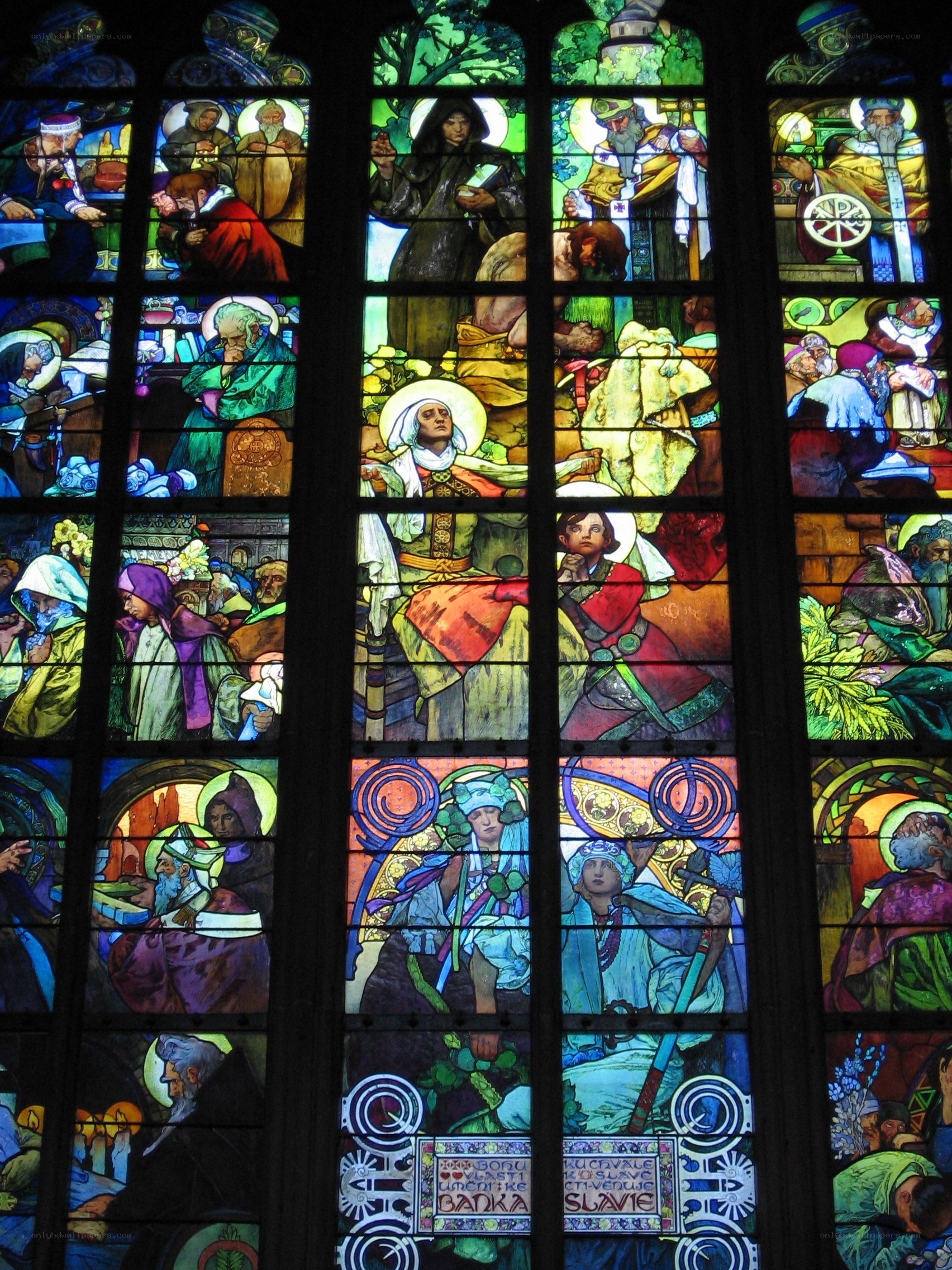 Stained glass window with religious scenes