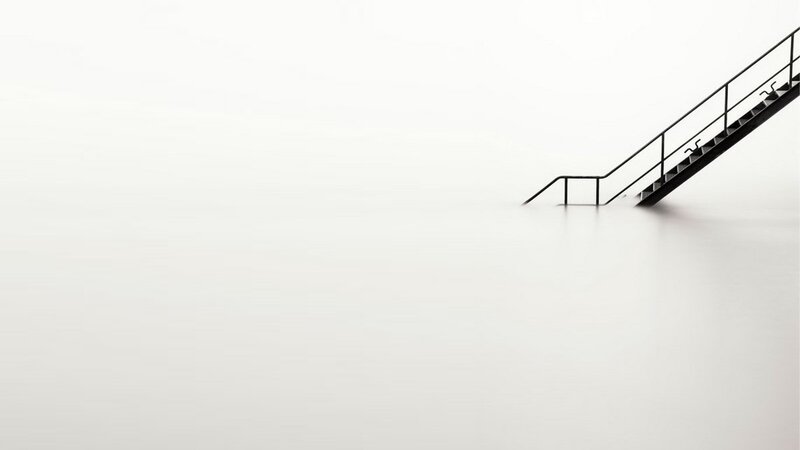 Staircase in misty water