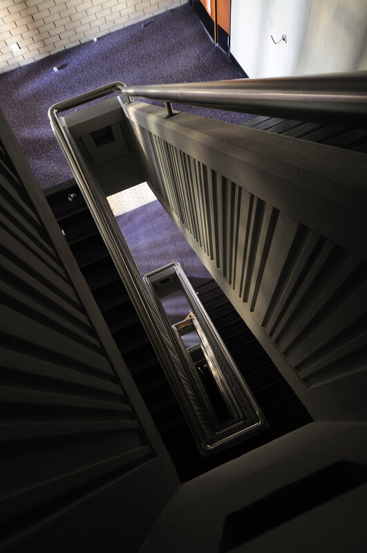 staircase with metal railing