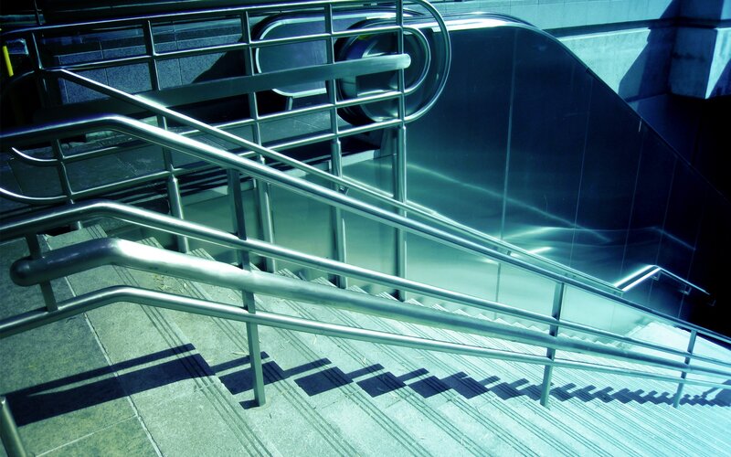 Staircase with metal railings
