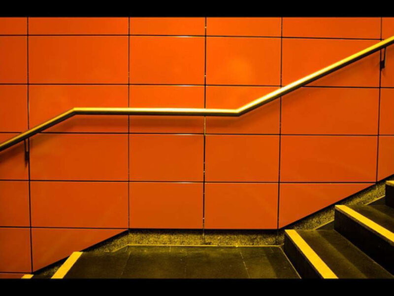 Staircase with orange wall