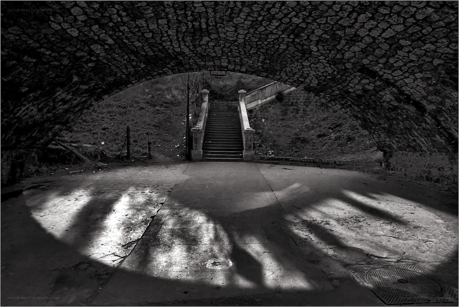 Stairway under stone arch