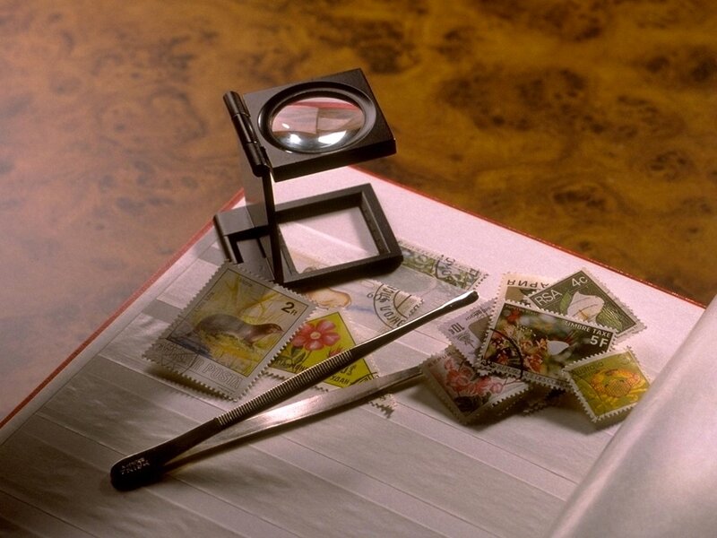 Stamp collection with magnifying glass