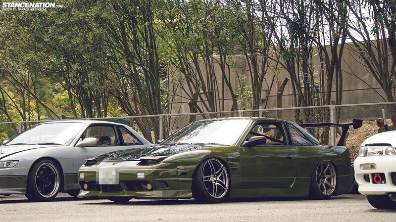 Stanced cars in a parking lot