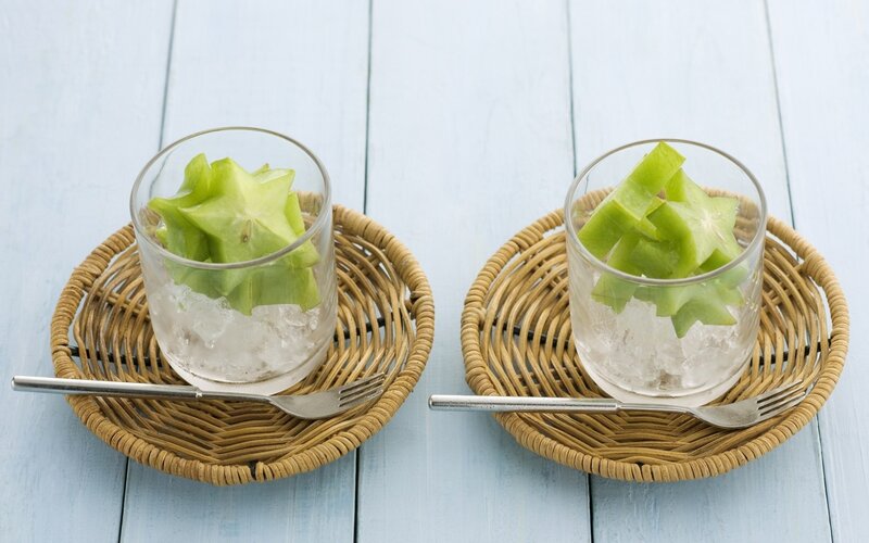 Star fruit in glasses on trays