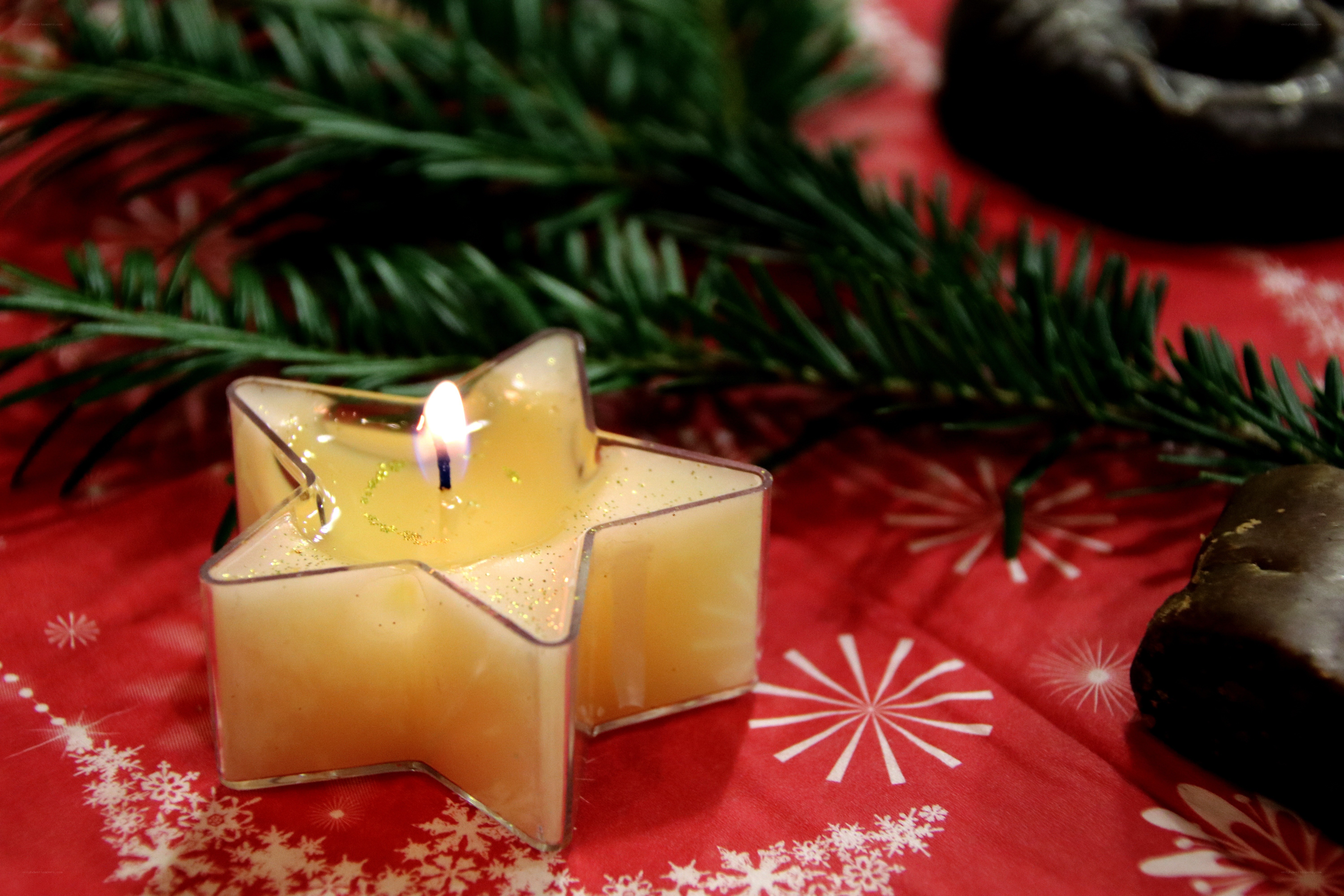 Star-shaped candle on festive table