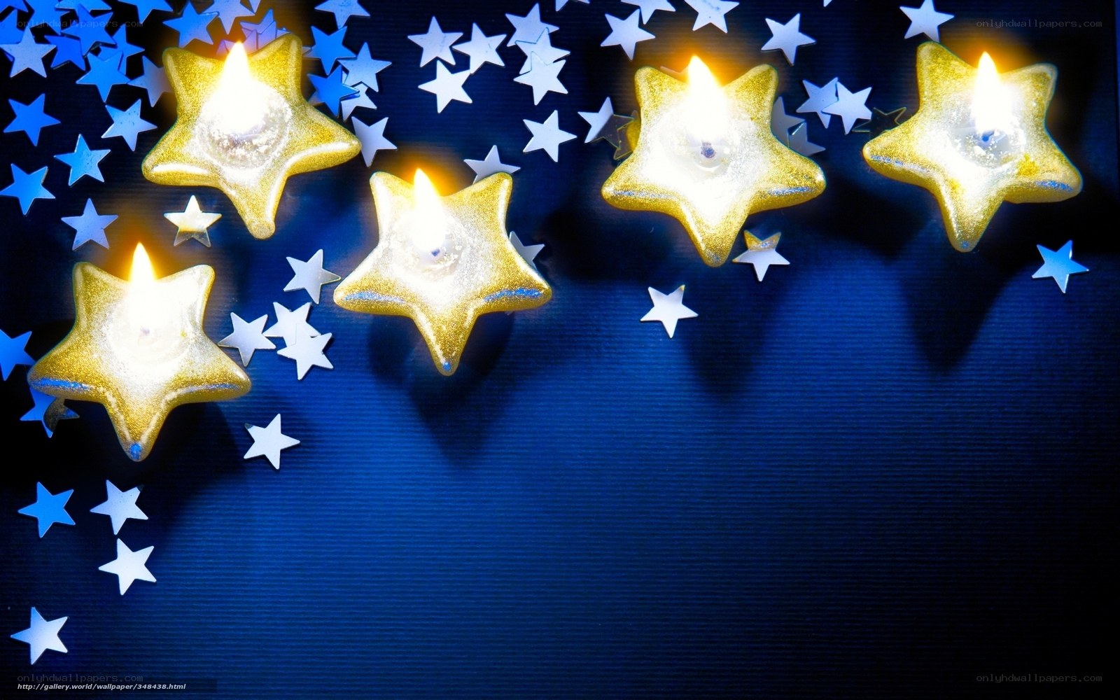 Star-shaped candles on blue