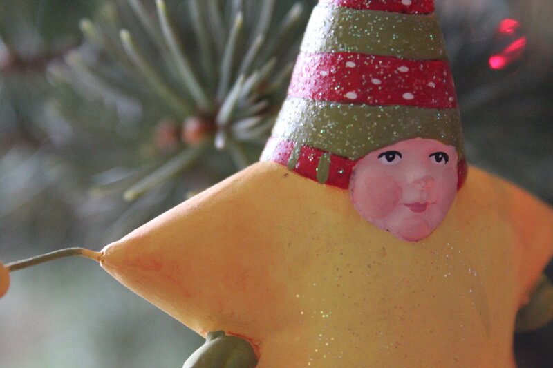 star-shaped ornament with face