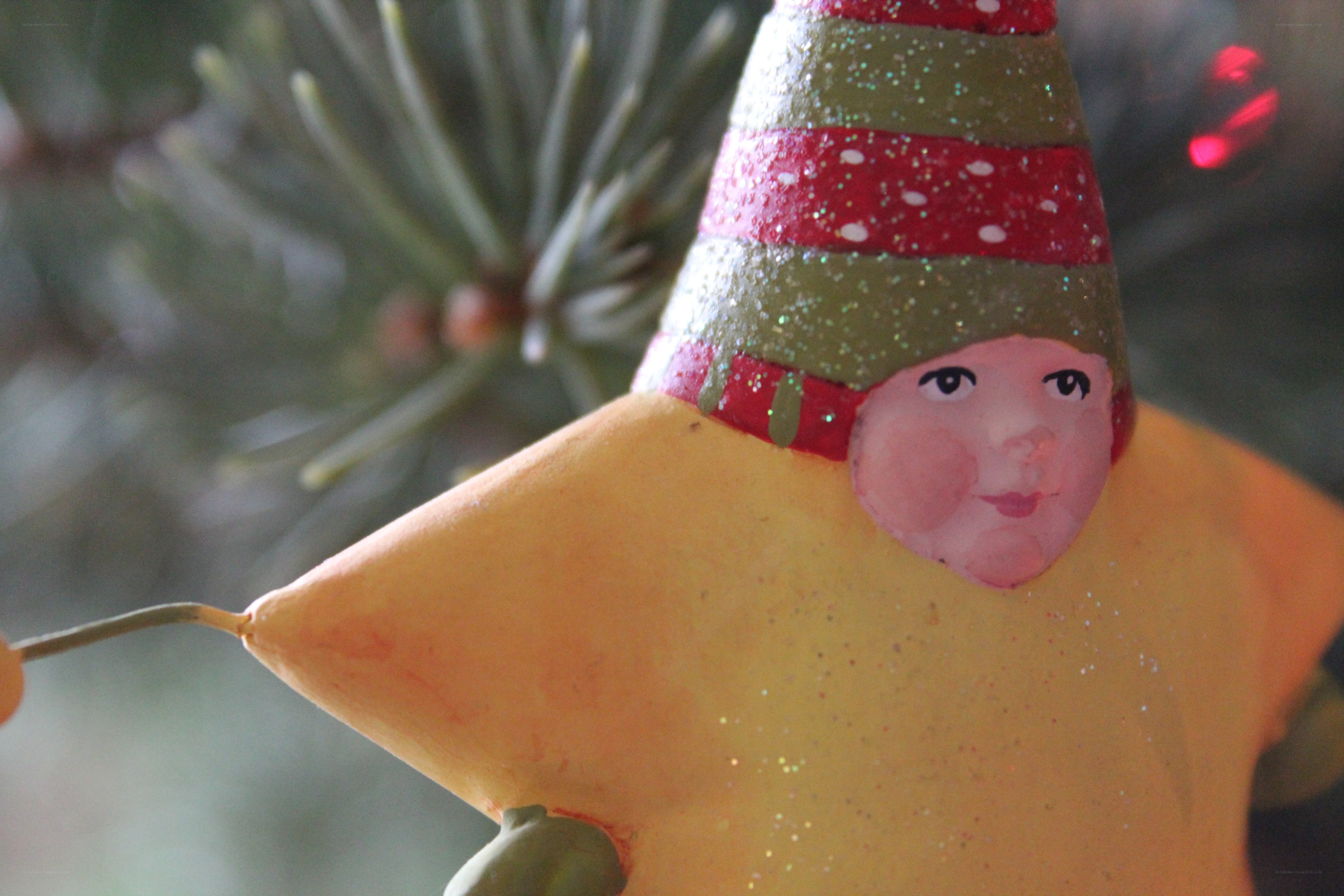 star-shaped ornament with face