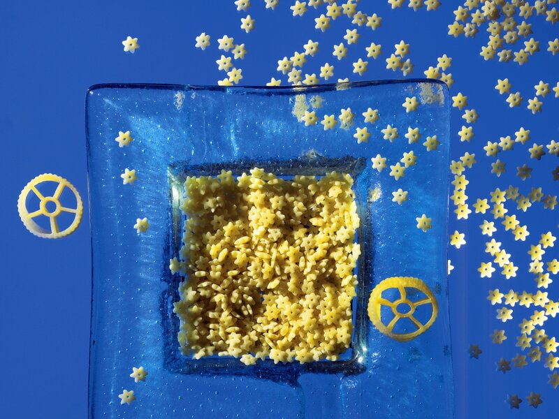 Star-shaped pasta on blue glass