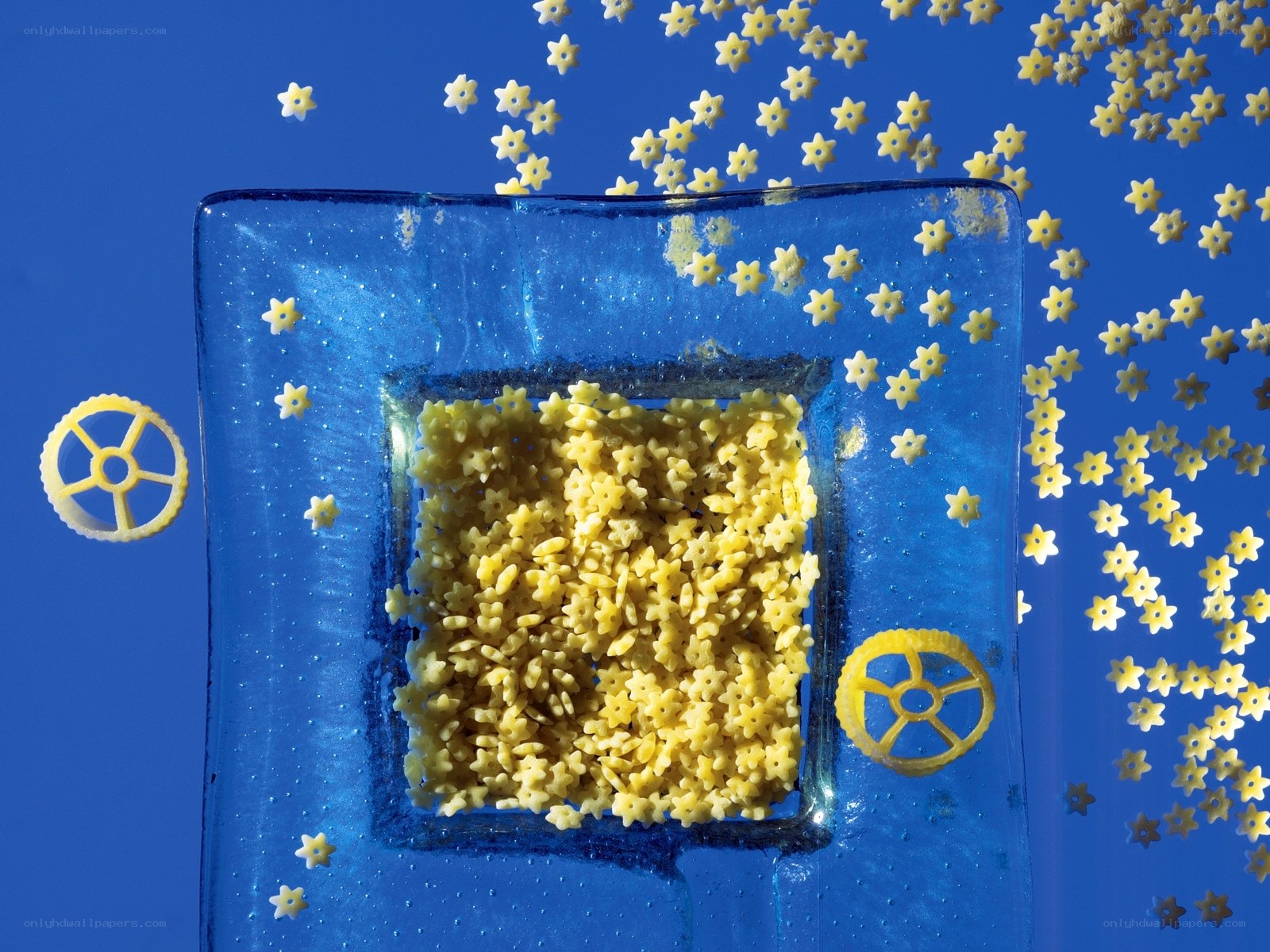 Star-shaped pasta on blue glass