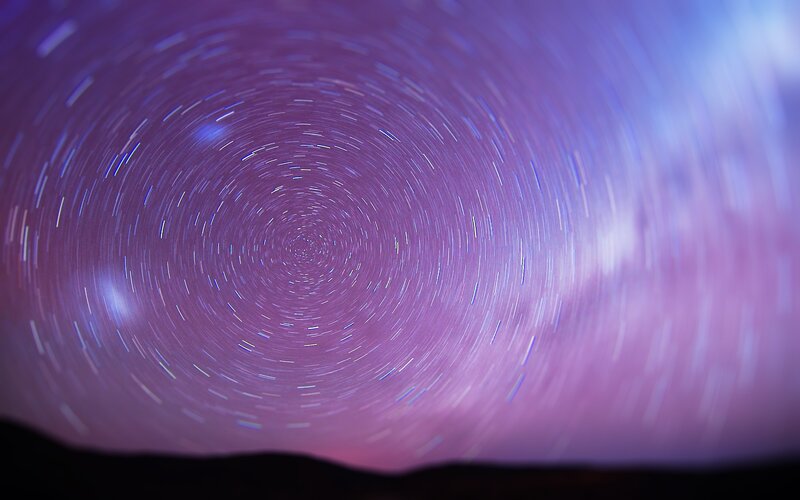 Star Trails in Night Sky — Purple