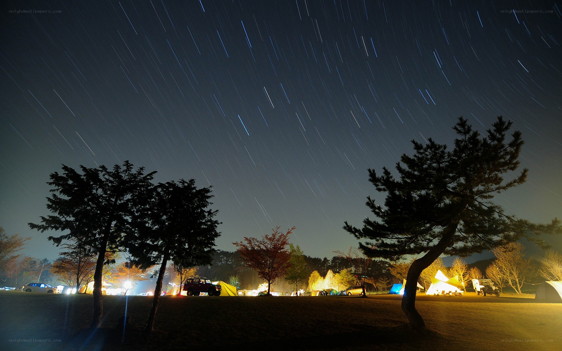Star trails over a campsite