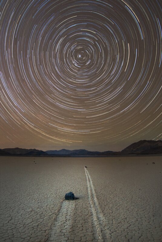 Star trails over a desert