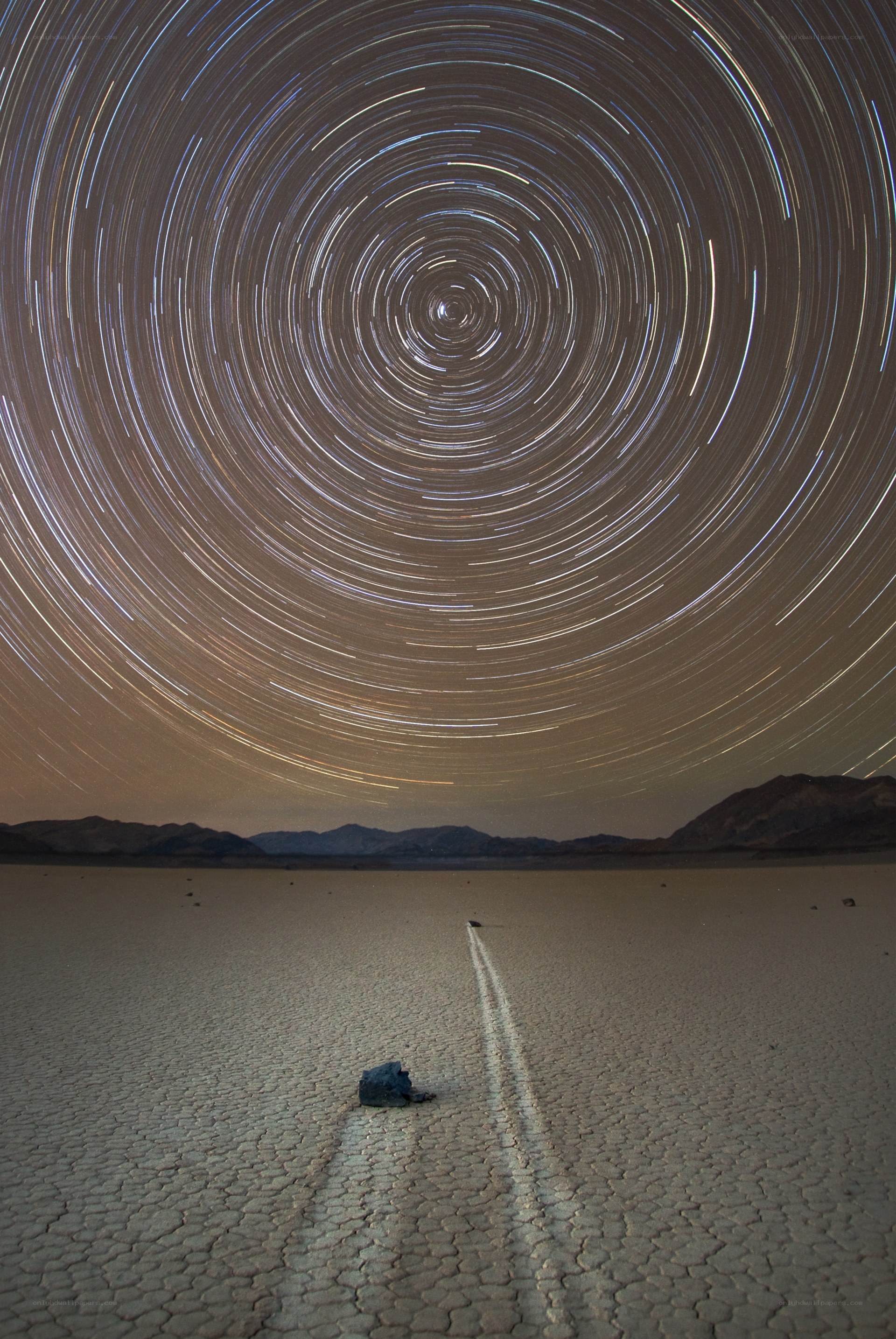 Star trails over a desert