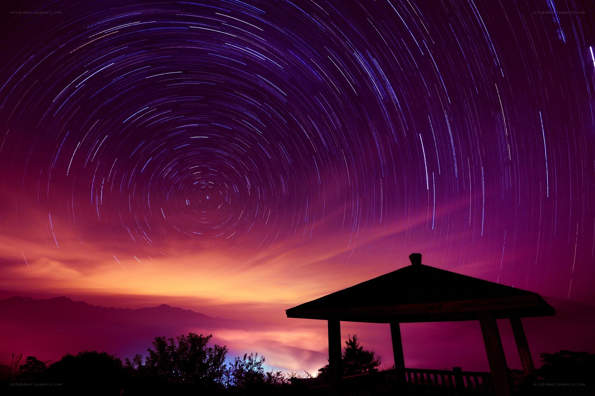 Star trails over a gazebo