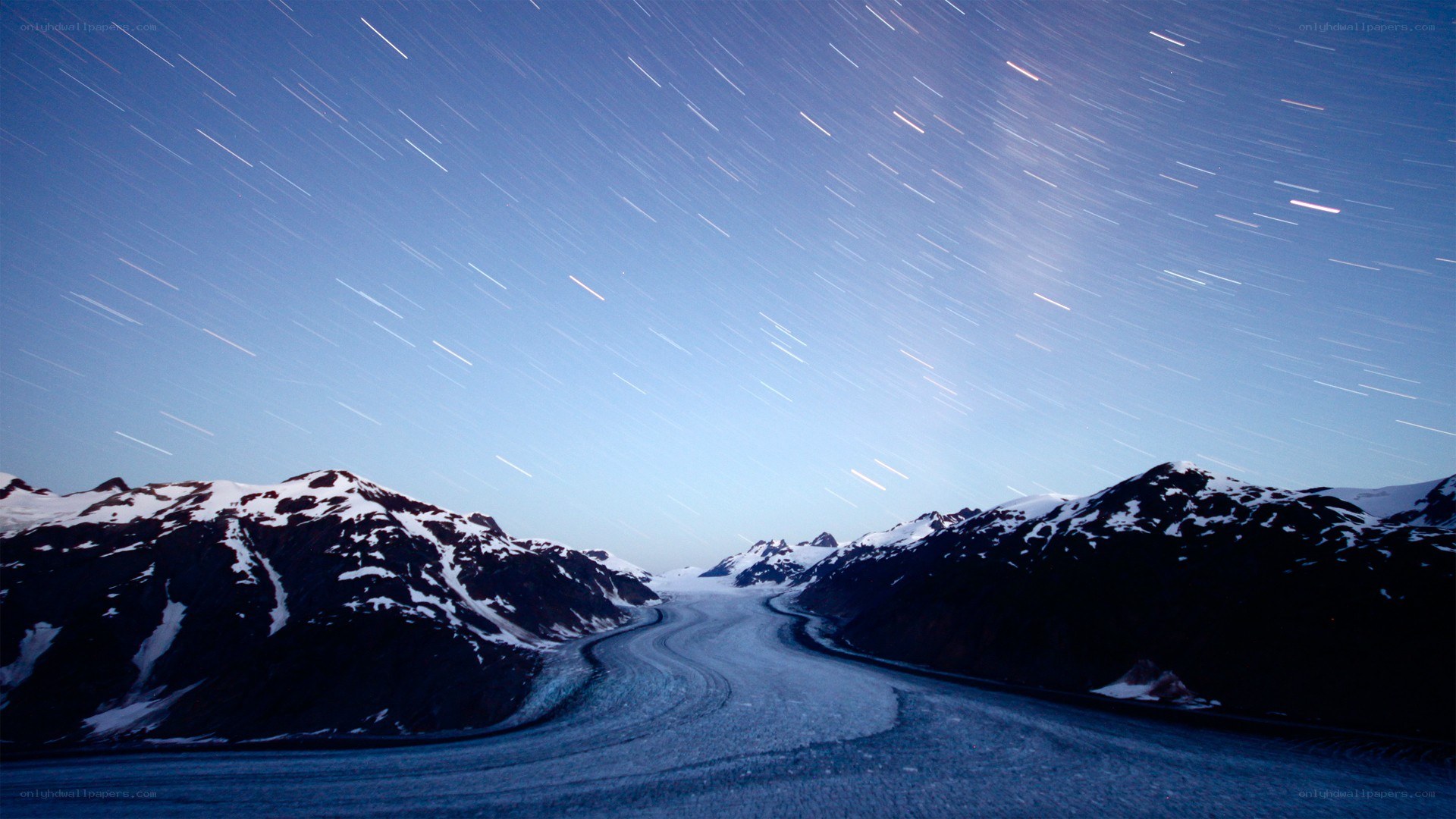 Star trails over a glacier