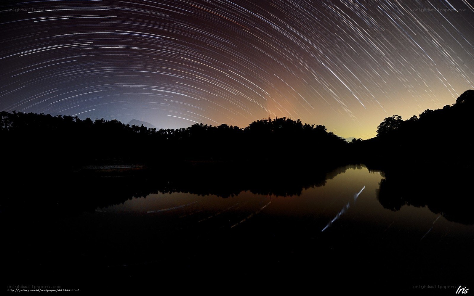 Star trails over a lake