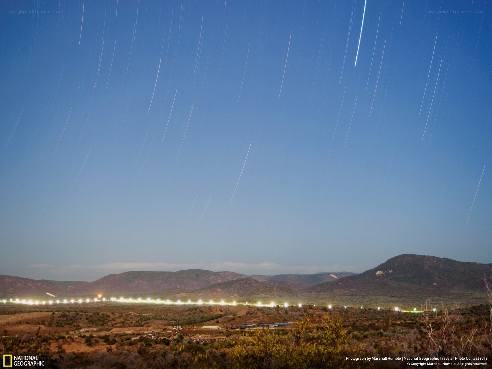 Star trails over a landscape