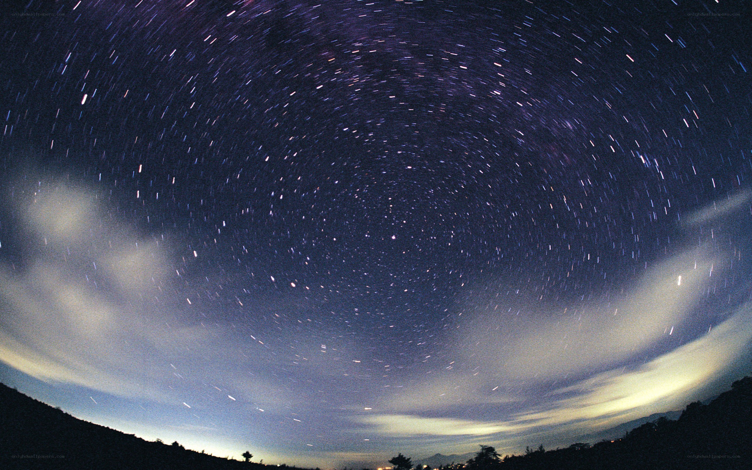 Star trails over a landscape
