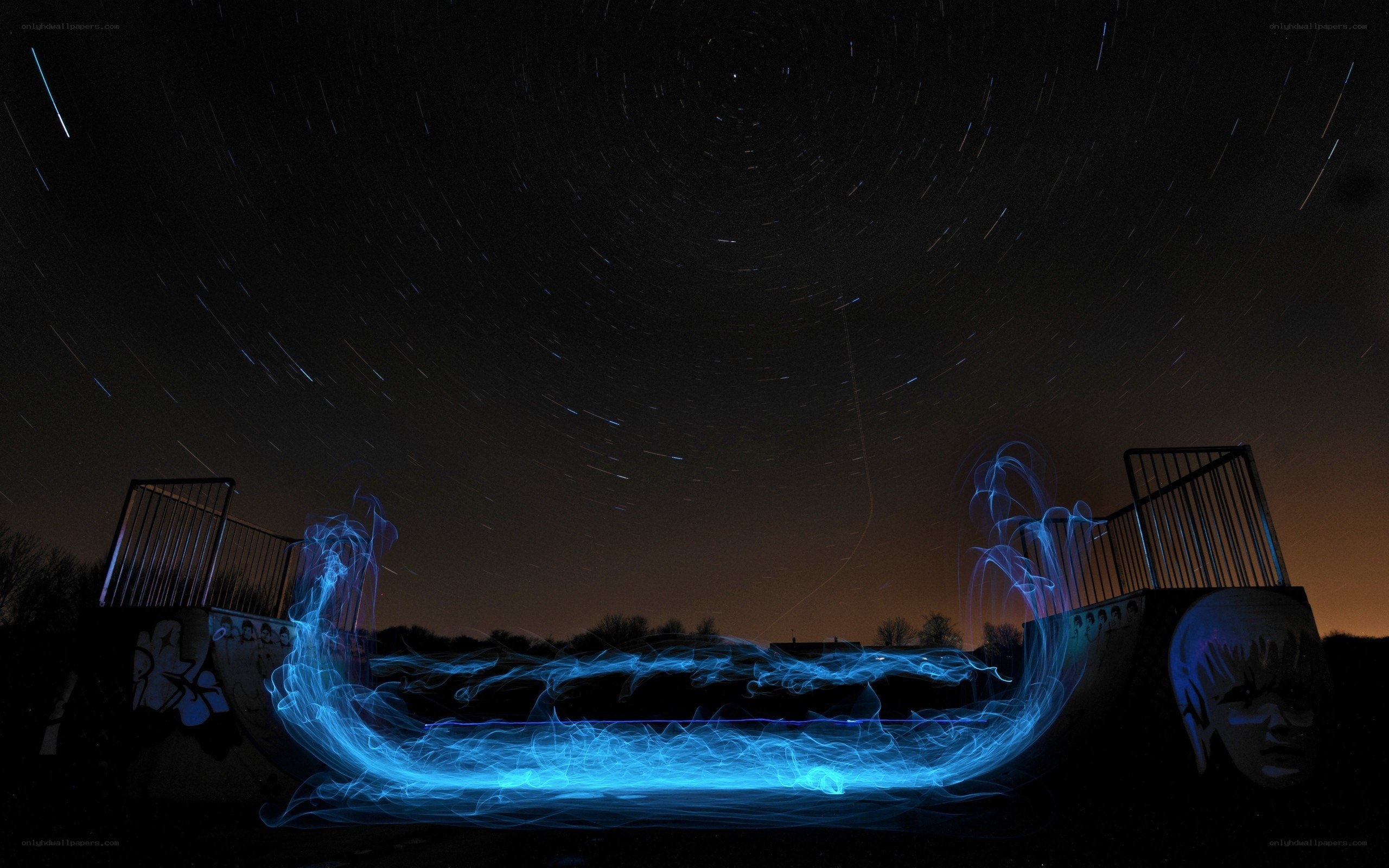 Star trails over a skate ramp