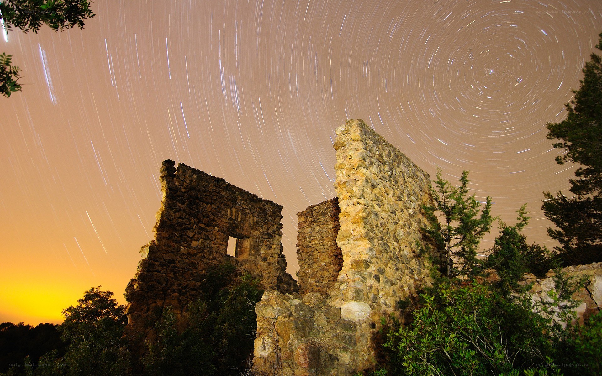 Star trails over ancient ruins