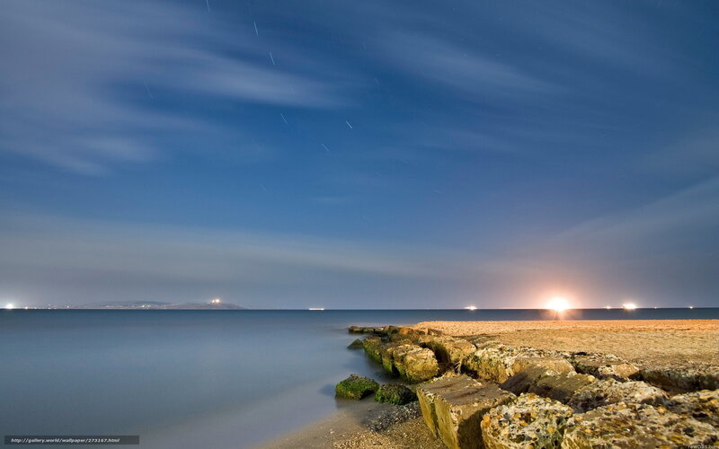 Star trails over coastal rocks