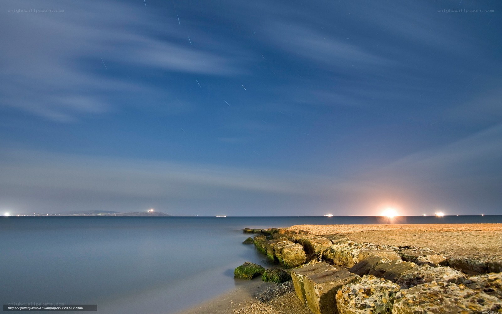 Star trails over coastal rocks