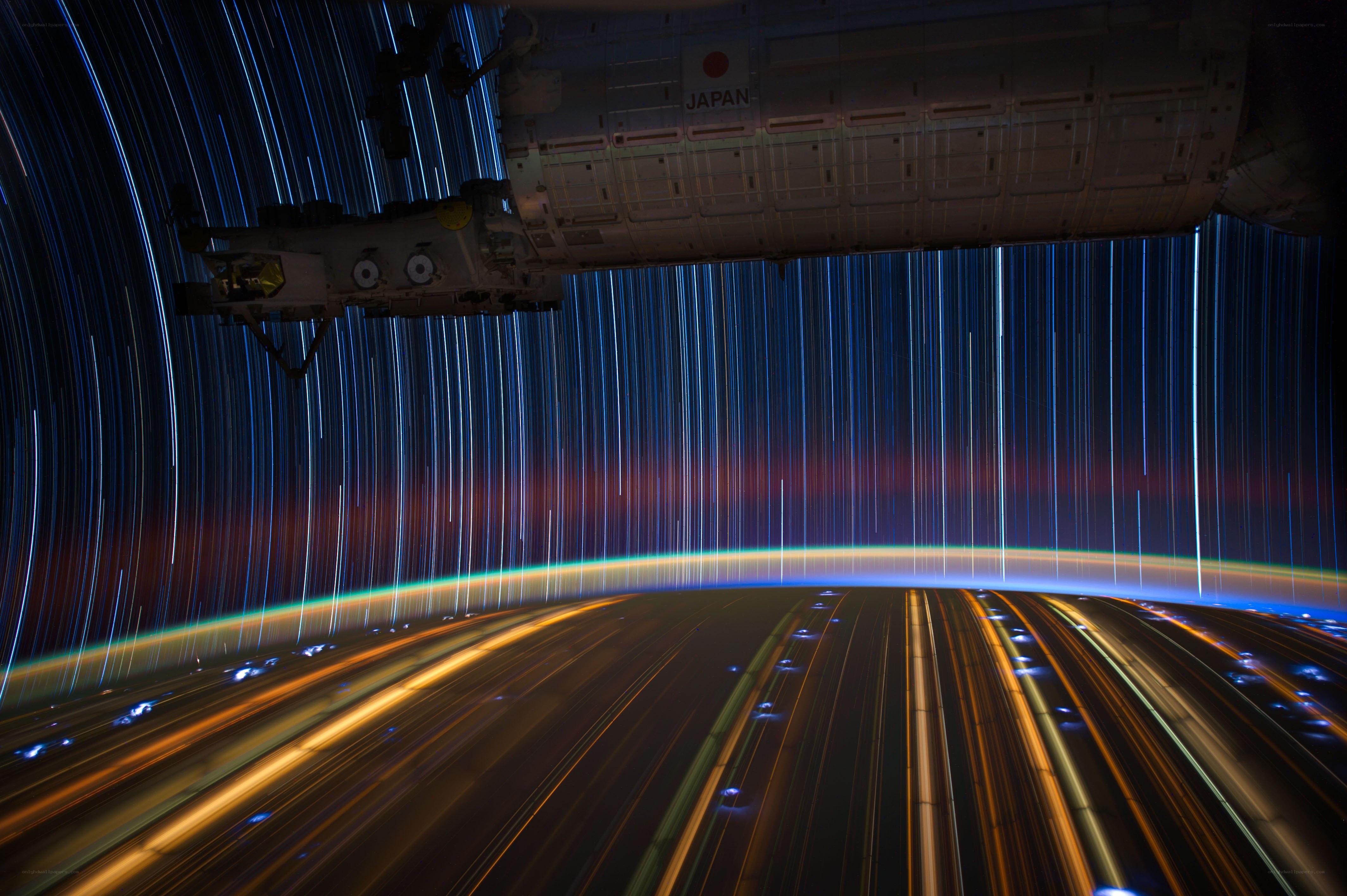 Star trails over Earth from space