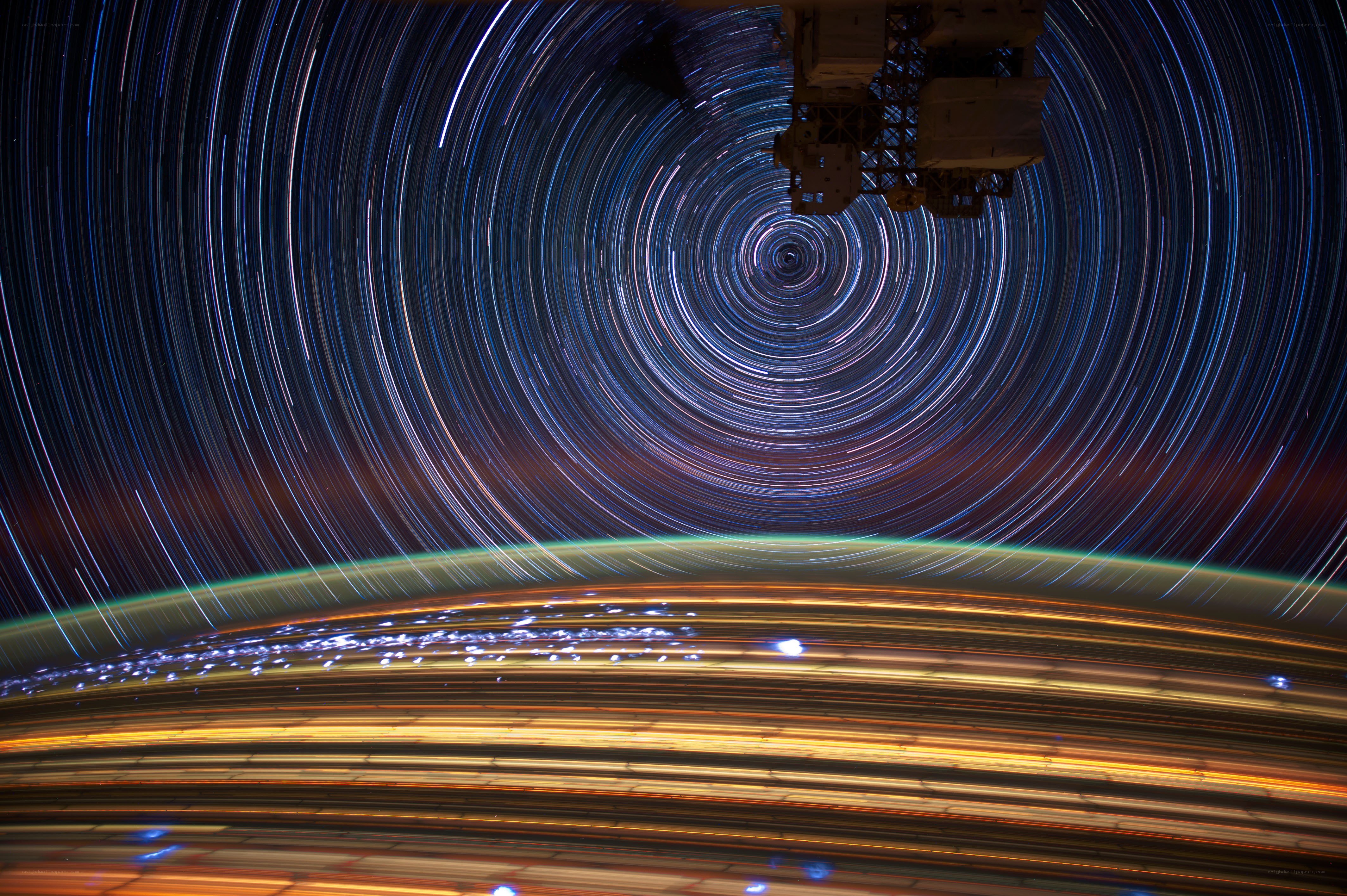 Star trails over Earth from space