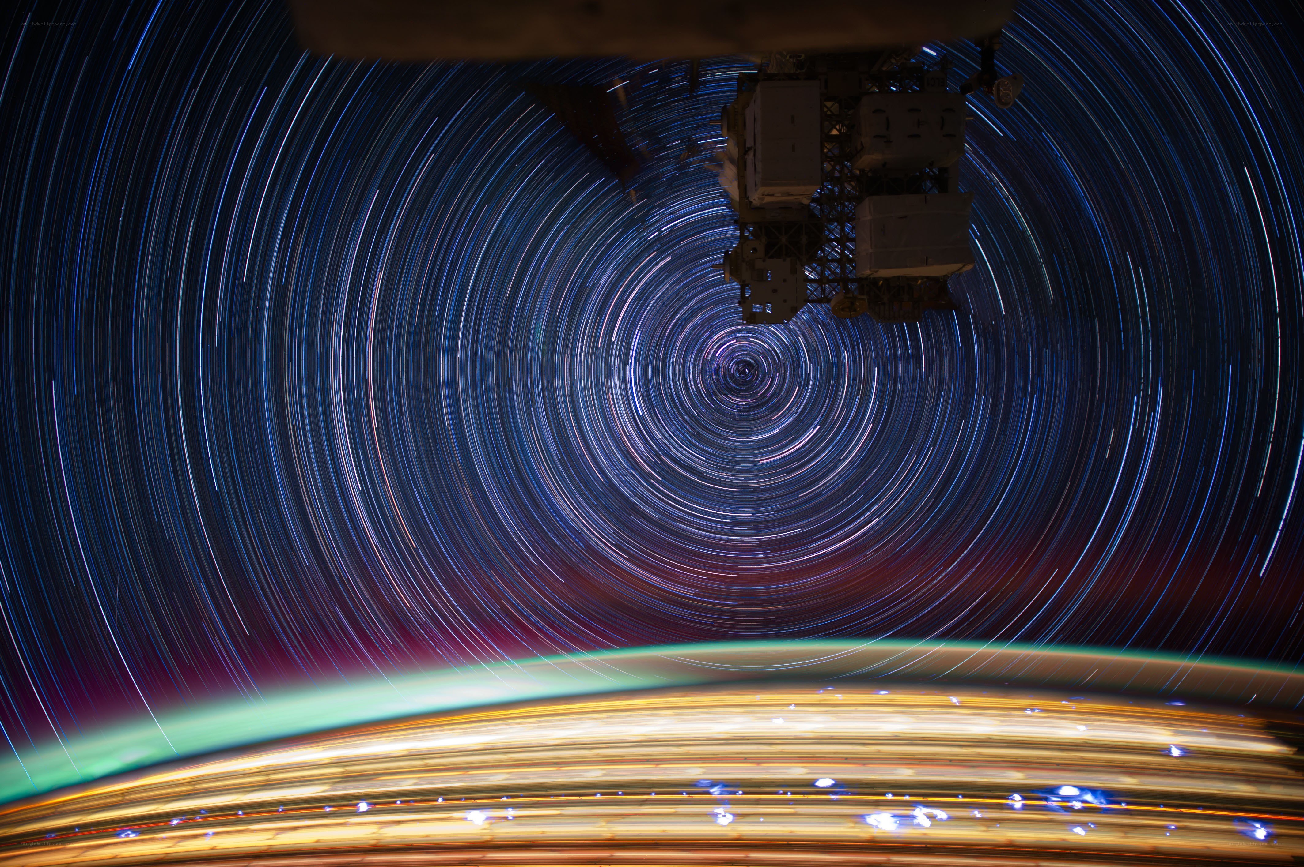 Star trails over Earth from space