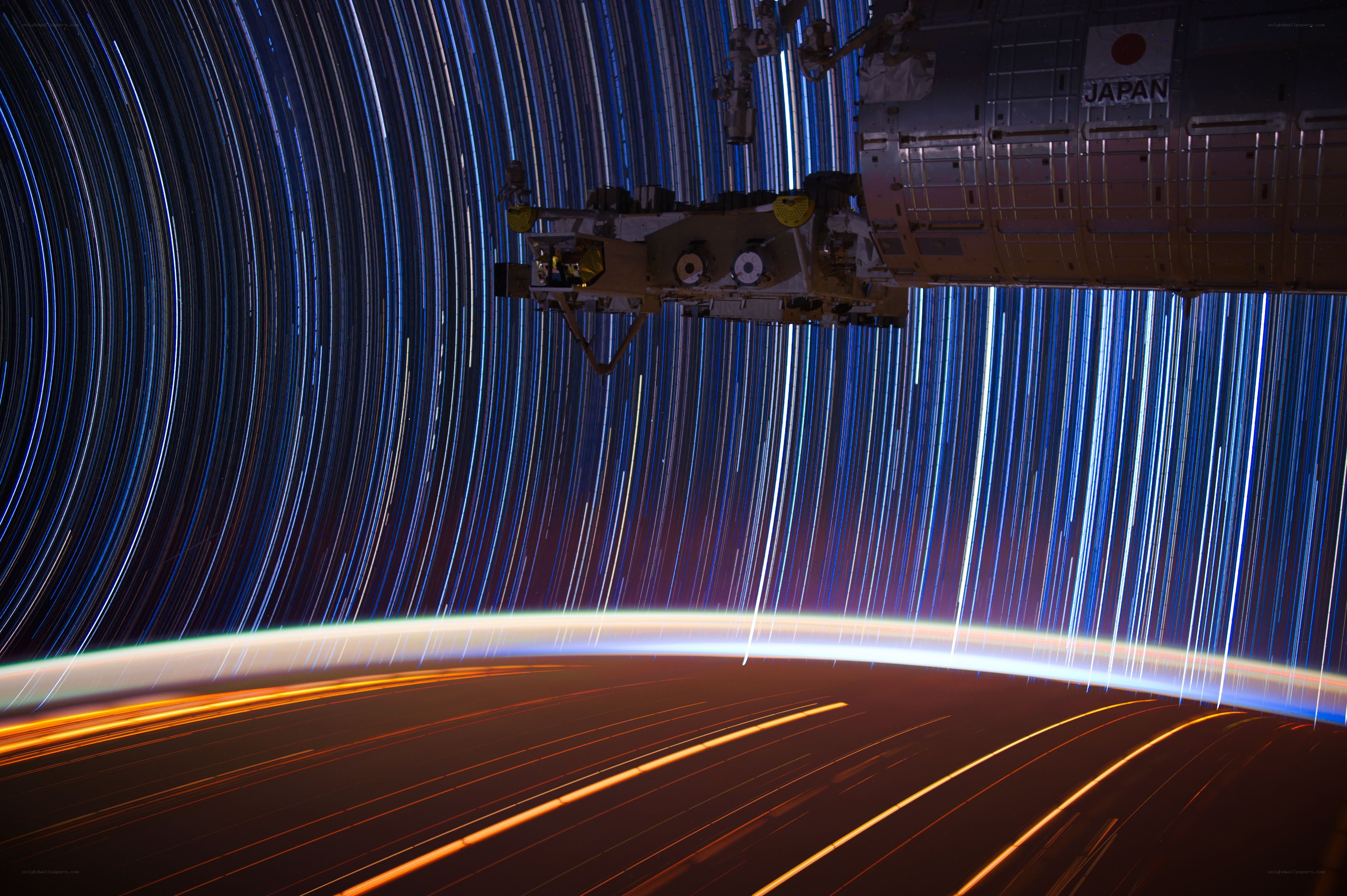 Star trails over Earth from space