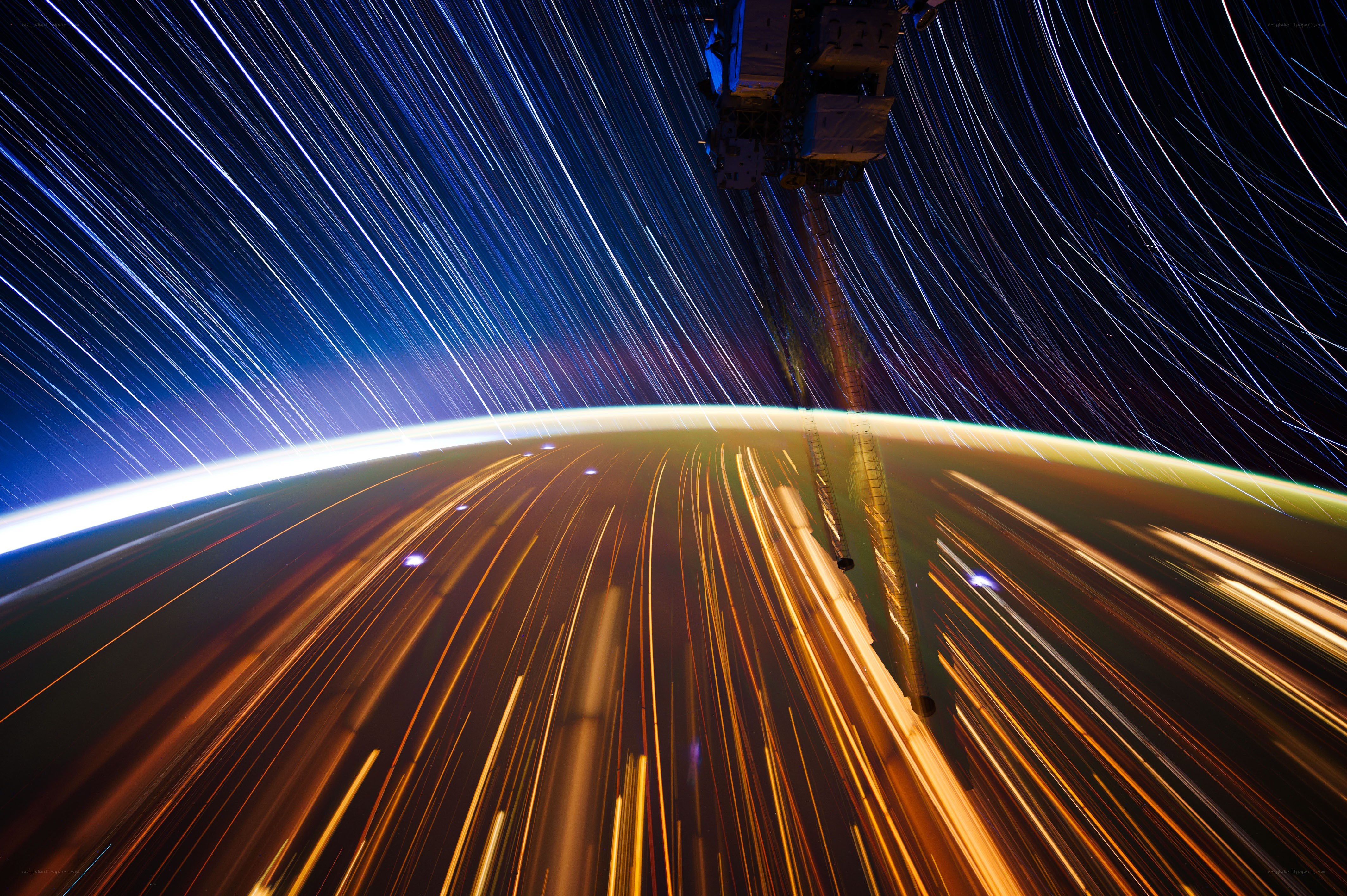 Star trails over Earth from space