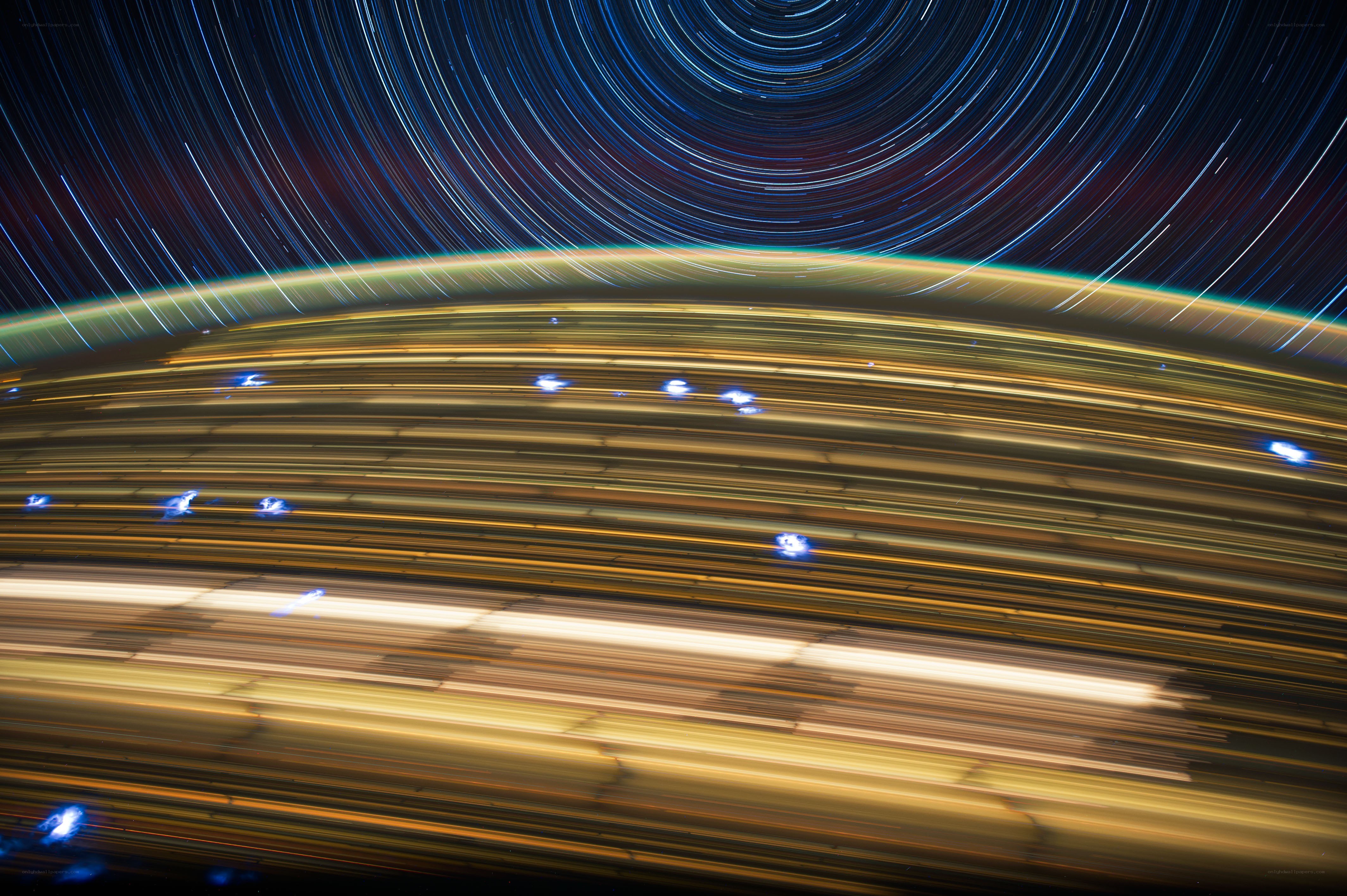 Star trails over Earth's horizon