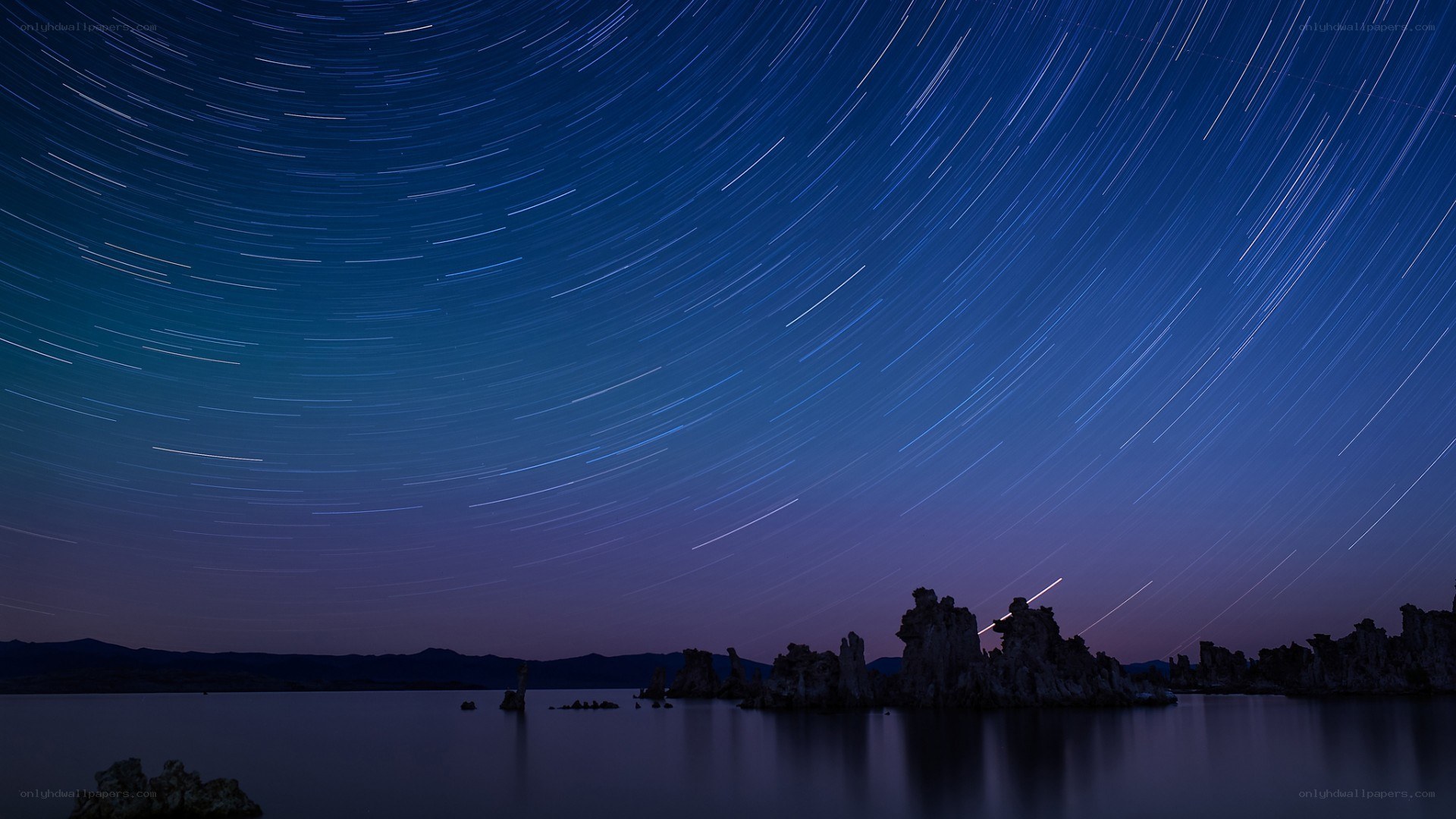Star trails over lake tufa