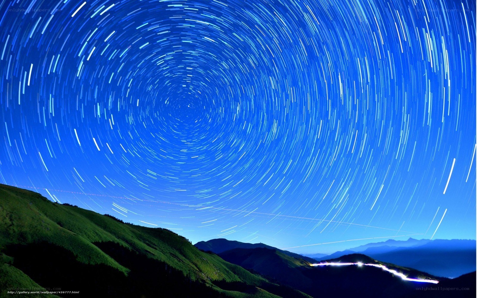 Star trails over mountain landscape